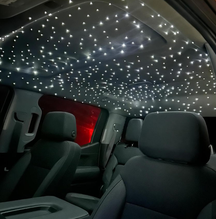 Modern farmhouse garage door with black trim and white vertical siding