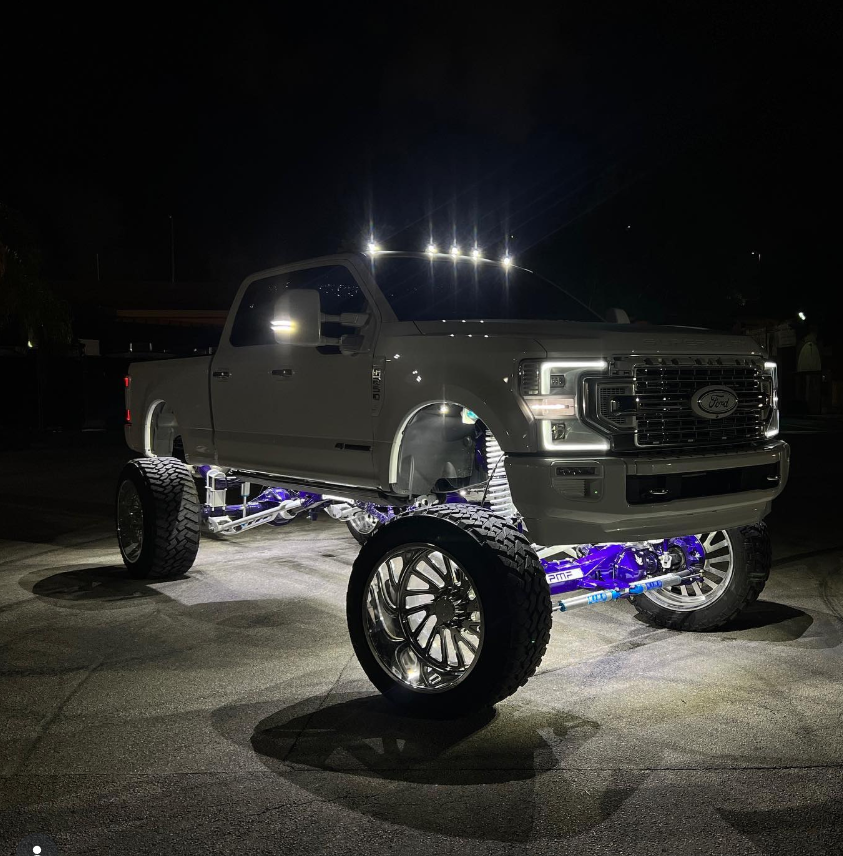 Craftsman style home with custom garage doors and covered porch